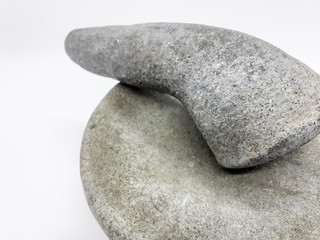 Fototapeta na wymiar Javanese Black Traditional Natural Crush Mortar Stone for Kitchen Utensils in White Isolated Background