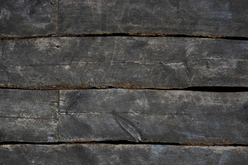 The old plank surface is brown in color. Outdoor