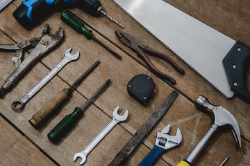 old instruments constructor or renovation for build and repair house on wooden background