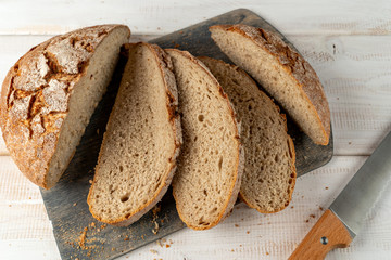 sliced rye bread and knife close up