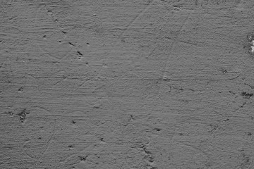 Texture of a concrete wall with cracks and scratches which can be used as a background