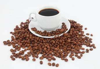cup of coffee with beans on white background