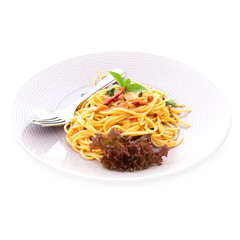 Delicious spaghetti served on white plate