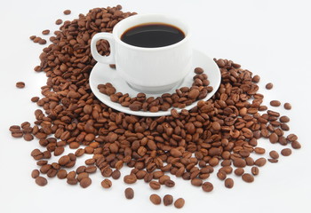 cup of coffee with beans on white background