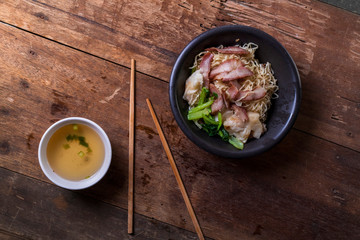Traditional Thai egg noodles on wooden table top
