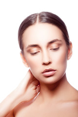 Obraz premium Beauty portrait of young fashion model woman with perfect skin, natural nude makeup, hair style. Isolated. White background. Skincare facial treatment concept