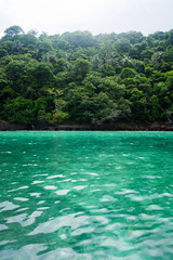 View of tropical island jungle from on the Andaman sea near Krabi Thailand