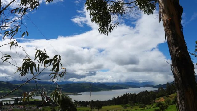 Time lapse Colombian landscape Guatavita, Tomine Dam in Cundinamarca at the north of Bogot&aacute; city, Clouds moving, old tree and mountains.