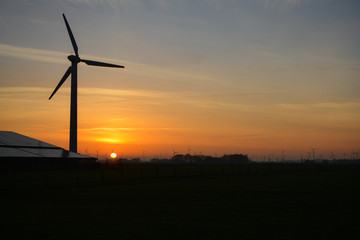 a wonderful sunrise over  windmills