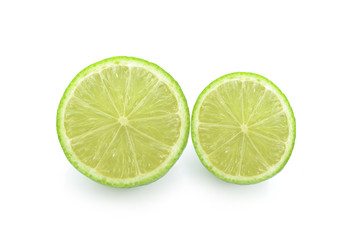 Half of lime citrus fruit (lime cut) isolated on white background.