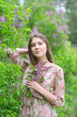 Fototapeta premium beautiful girl in a blooming Park