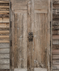 Old wooden doors that are closed