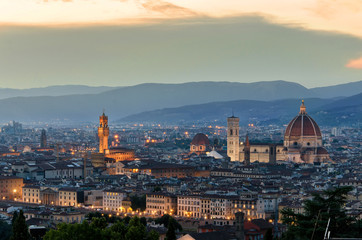 Fototapeta na wymiar Panorama of evening Florence. Sunset in Italy. Duomo - Santa Maria del Fiore. Cheap hotels in Florence, Tuscany, Italy.
