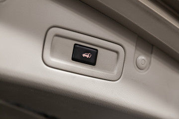 Close-up of the trunk release button. modern car interior: parts, buttons, knobs.