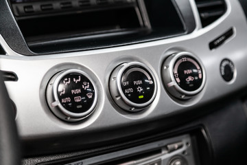 Close up car ventilation system and air conditioning - details and controls of modern car..