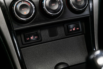 Close-up of seat heating buttons. modern car interior: parts, buttons, knobs.