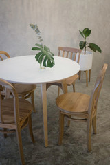 Fototapeta na wymiar Cozy coffee shop with wooden furniture set