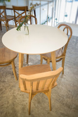 Cozy coffee shop with wooden furniture set