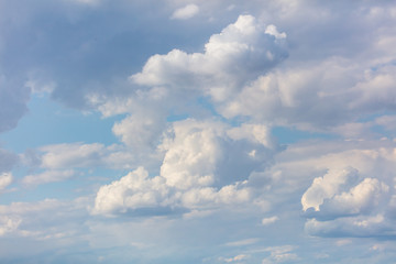 Clouds in the blue sky fly in the air