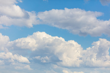 Clouds in the blue sky fly in the air