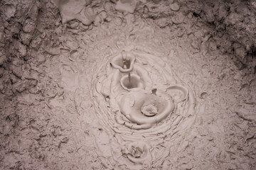 Obraz premium Bubbling mud volcano in Uzon caldera. Kronotsky Nature Reserve in Russian far east, Kamchatka peninsula. Protected environment where only few tourists can come. Access by helicopter only.