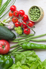 Healthy food in paper bag of different  vegetables on white background. Top view.