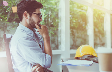 Engineer man wearing glasses with beard working online at home