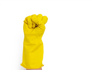 Hand in a yellow rubber glove gesturing fist isolated on white background