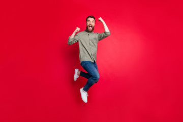 Full length body photo of crazy guy enjoying his promotion at work while isolated with red...