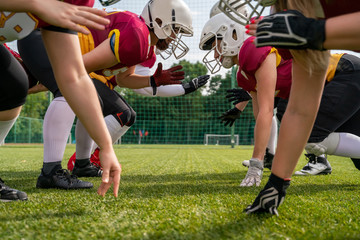 Fototapeta premium Photo of sportsmen playing american football on sports field