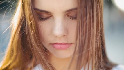Tranquility, harmony. Peaceful, relaxed teen girl lost in thoughts with eyes closed.