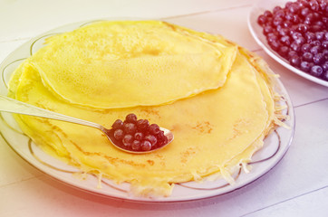 delicious, homemade pancakes with blueberries. Pancakes and berries in a plate on a white.