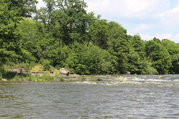 Small rapids on flat rivers attract tourists and travelers in the summer