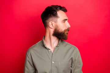 Obraz premium Photo of suspicious man showing results of his barber work while isolated with red background