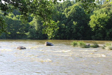 Small rapids on flat rivers attract tourists and travelers in the summer