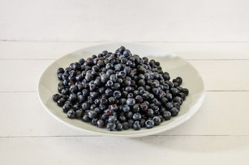 tasty blueberries in a plate. Close-up.