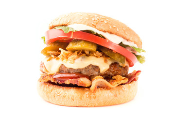 Delicious fast food. Big cheeseburger isolated on white background