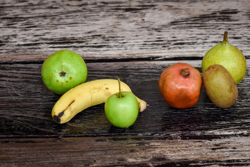 Fruits lying on the wooden table.