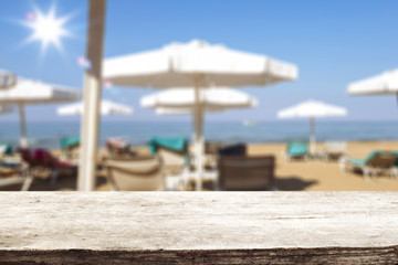 desk of free space and beach background 