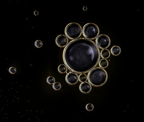 abstract black background with bubbles of oil