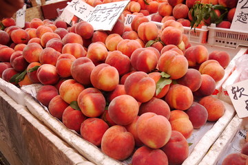 Peaches on a fruit stall in a market in Qingdao, China.