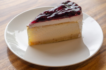 Blueberry Cheesecake Pie on a white plate,have copy space.