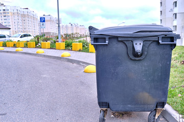 Public trash in the city. Trash can on the road. Garbage.