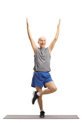 Elderly man exercising and stretching a leg