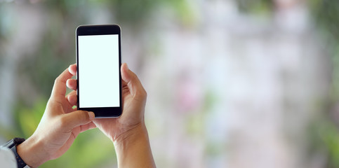 Close-up view of man holding blank screen smartphone