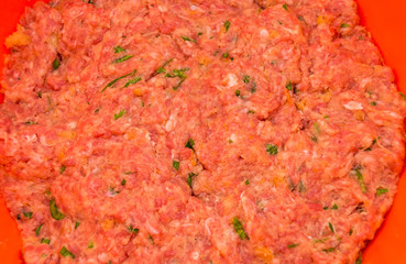minced beef meat with herbs close-up