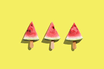 Three piece of Watermelon on yellow backgroud