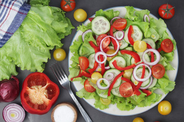 A plate full of bright fresh vegetable salad	