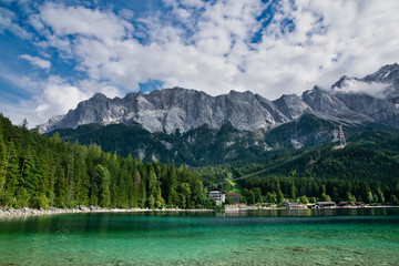 Eibsee lake in front of Zugspitze mountain in Bavaria Germany. Gorgeous panoramic mountain view. Alpine landscape with German Alps and Austrian Alps mountain Zugspitze 