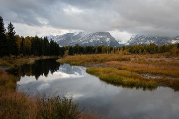 Fototapeta premium Teton Range covered in clouds in autumn, Grand Teton National Park